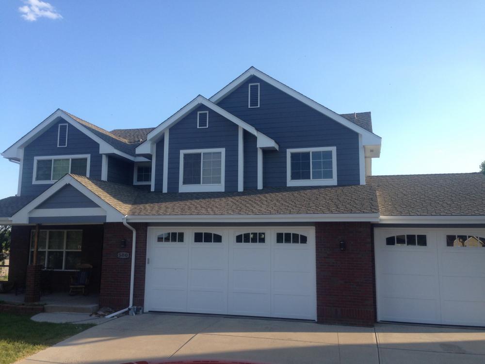 Dark blue-gray home with garage in Windsor, CO