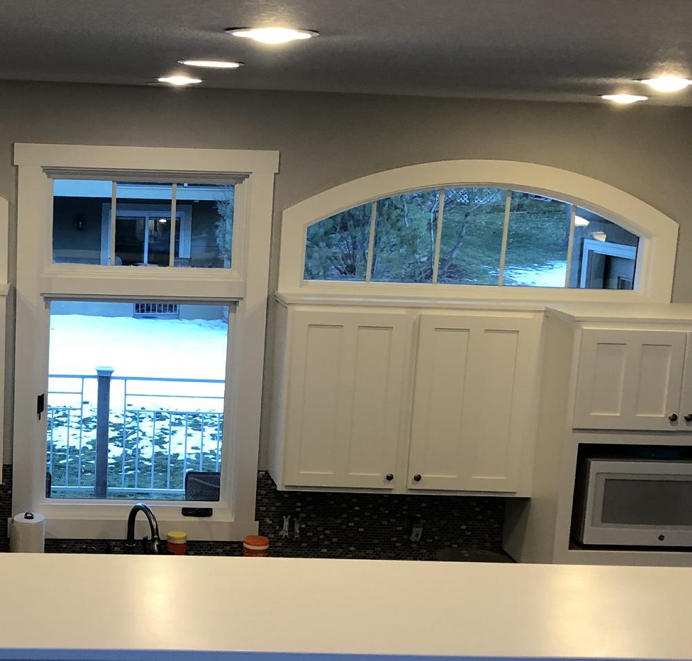 Painted cabinets near kitchen window in Windsor, CO